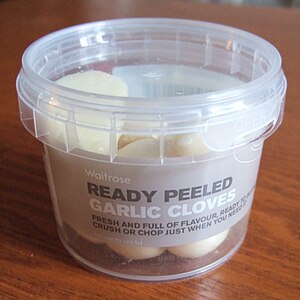 English: Waitrose ready peeled garlic in a pla...