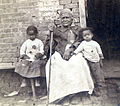 A former slave of U.S. President Andrew Jackson (probably Betty Jackson) and two of her great-grandchildren.