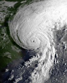 A hurricane with its eye close to the northeastern United States; most of its clouds are on the northern side of the circulation