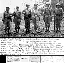General Douglas MacArthur meeting with Navajo, Pima, Pawnee, and other Native American troops in late 1943 during World War II General douglas macarthur meets american indian troops wwii military pacific navajo pima island hopping.JPG