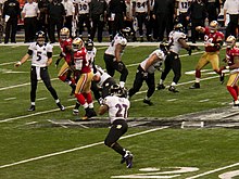 Baltimore Ravens quarterback Joe Flacco attempts a pass to Ray Rice. Joe Flacco passes to Ray Rice in Super Bowl XLVII.jpg