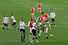 Arsenal playing against rivals Tottenham, in a game known as the North London derby, in November 2010 Laurent Koscielny clashes with Heurelho Gomes.jpg