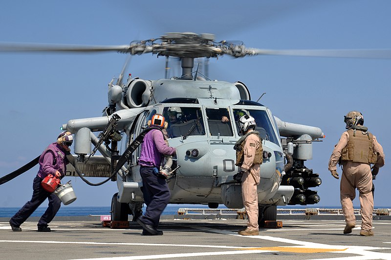 800px-US_Navy_110325-N-7293M-126_Sailors_run_to_refuel_an_MH-60S_Sea_Hawk_helicopter.jpg