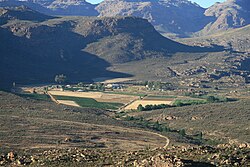 Locatie wijngaard. Soms duiken wijngaarden op onverwachte plaatsen op. Voorbeeld: Cederberg, Zuid-Afrika.