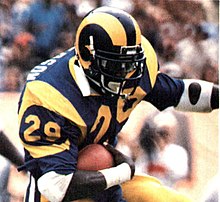 Eric Dickerson, one of the best running backs in history, was most famous for his time with the Los Angeles Rams. In 1984, Dickerson rushed for 2,105 yards in the season, a record that still stands today. 1985 Police Raiders-Rams - 20 Eric Dickerson (crop).jpg