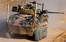 Colour photo of a wheeled military vehicle