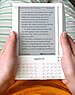 English: Amazon Kindle e-book reader being hel...