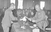 General Chen Yi (right) accepting the receipt of General Order No. 1 from Rikichi Ando (left), the last Japanese governor-general of Taiwan, in Taipei City Hall Ando Rikichi surrender.jpg