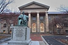 In the basement of Goldwin Smith Hall, researchers in the Dendrochronology Lab determine the age of archaeological artifacts found at archeological digs. Andrew Dickson White statue and Goldwin Smith Hall.jpg