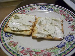 Cream crackers with cheese spread.jpg