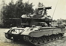 Early pre-series vehicle on trial for the Royal Netherlands Army in 1976. Dutch Cheetah PRTL (Flakpanzer Gepard) Trials 1976.jpg