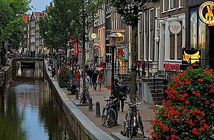 De Wallen, Amsterdam's red-light district, is internationally known and one of the main tourist attractions of the city. It offers legal prostitution and a number of coffee shops that sell marijuana. Red-light district of Amsterdam by day. 2012.JPG