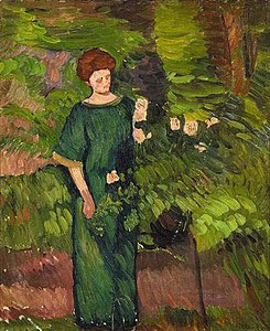 Femme en vert, cueillant une rose sur un rosier arbuste sur un fond verdoyant