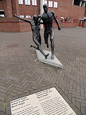 Bronze statue of Johan Cruyff and Berti Vogts (depicting tackling of Vogts versus Cruyff in World Cup final 1974) in front of the Olympic Stadium in Amsterdam, by Ek van Zanten. Amsterdam Voetballers Olympiastadion NW 9075 201810.jpg