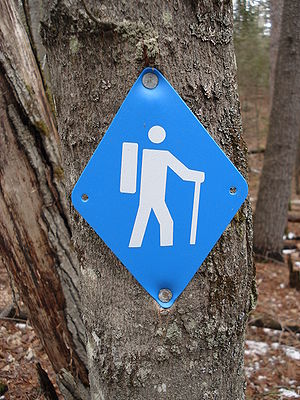 Blue diamond-shaped sign used to designate hik...
