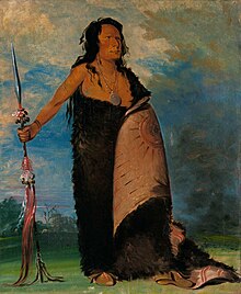 full length painting of a Native American wearing a buffalo hide and holding a shield in his left hand and a spear in his right hand