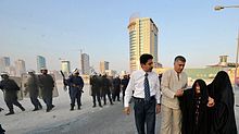 Nabeel Rajab helping an old woman after Bahraini police attacked a peaceful protest in August 2010 Nabeel Rajab and Abdulhadi Alkhawaja helping an old woman after police attacked a peaceful protest in August 2010.jpg