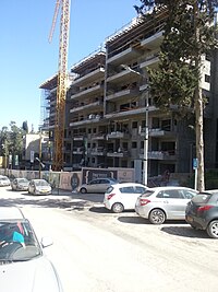 New buildings under construction in Haifa as part of the evacuate and build program Pinuy binuy.jpg