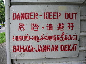 Quadrilingual warning sign in Singapore. The t...