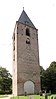 Toren van de in 1828 gesloopte kerk, sober bakstenen bouwwerk. Klokkenstoel met klok van G. Koster, 1672, diam. 121,8 cm
