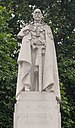 A close up of the statue on top of the plinth