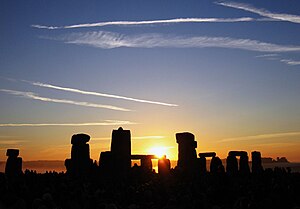 The sun rising over Stonehenge on the summer s...