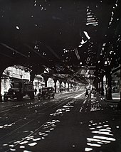 The Bowery under the El, from Division Street, 1936, Berenice Abbott El', Second and Third Avenue lines, Bowery taken from Division St., Manhattan (NYPL b13668355-482843).jpg