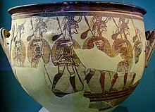 Marching soldiers on the Warrior Vase, c. 1200 BC, a krater from Mycenae Large Krater with Armored Men Departing for Battle, Mycenae acropolis, 12th century BC (3402016857).jpg