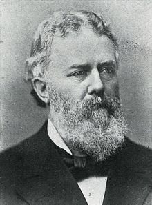 Black and white photo of a bearded man