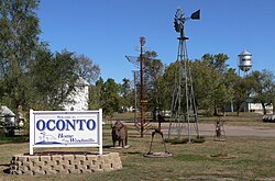 Oconto welcome sign, windmill, and sculptures
