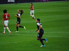 Alex Morgan (no. 13) and Abby Wambach (no. 14); Morgan and Wambach combined for 55 goals in 2012 - matching a 21-year-old record set in 1991 by Michelle Akers (39 goals) and Carin Jennings (16 goals) as the most goals scored by any duo in U.S. women's team history. Olympic women's soccer final 2012.jpg