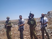 IDF soldiers and Israeli settlers, 2009 SettlersSoldiersIraqBurin.jpg