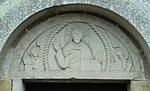 Othelric me fecit (Othelric gjorde mig). Den tyske 1100-tals stenmästarens signerade relief, med palmettranka i bården, från Skälvums kyrka nära Kinnekulle.