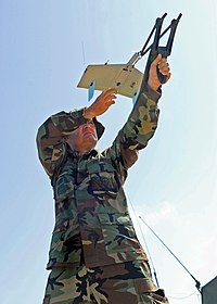 US Navy 070818-N-6652A-029 Storekeeper 1st Class Michael Lake, attached to Mobile Insure Undersea Warfare 109, prepares to launch an Unmanned Aerial Vehicle (UAV) during Field Exercise (FEX)