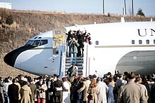 Families wait for the former hostages to disembark the plane Boeing VC-137 54.jpg