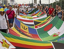LGBT activists at Cologne Pride carrying a banner with the flags of 72 countries where homosexuality is illegal Cologne Germany Cologne-Gay-Pride-2015 Parade-17a.jpg