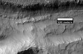 Close-up of gullies in trough, as seen by HiRISE under the HiWish program. These are some of the smaller gullies visible on Mars. Location is Phaethontis quadrangle.
