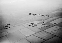Hawker Hurricanes and Supermarine Spitfires of the RAF flying in formation in 1940 Hurricanes 1 Sqn RAF and Spitfires 266 Sqn in flight 1940.jpg