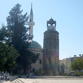 Mosque and clocktower in Peqin