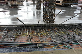 8. Post-tension cable ends extending from concrete slab