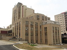 Salk Hall, where Jonas Salk's team performed the research that led to the first polio vaccine, is also the home of the School of Dental Medicine and School of Pharmacy. SalkHallSidePitt.jpg