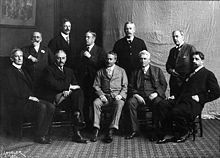 The Ten American Painters in 1908. The 10 were Childe Hassam, J. Alden Weir, William Merritt Chase, Robert Reid, Willard Metcalf, Frank Weston Benson, Edmund Charles Tarbell, Thomas Wilmer Dewing, Joseph DeCamp, and Edward Simmons. Ten American Painters (The Ten).jpg