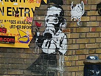 An example of Guerrilla art by Banksy found on Brick Lane, East End of London (2004) Banksy-art.jpg