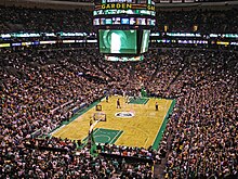 Professional basketball game between the Celtics and Timberwolves in a crowded arena