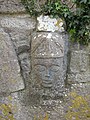 Carved head at the inner wall.