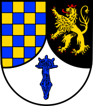 Bügelfibel von Freilaubersheim auf Wappen von Frei-Laubersheim