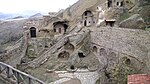 Caves with masonry around, part of the monastery