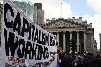 A banner reading "Capitalism isn't workin...