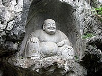 Sculpture of Budai at the Feilai Feng grottoes in Zhejiang, China. Northern Song dynasty, 11th century.