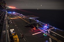 An AV-8B Harrier prepares to take off aboard Essex, off the coast of San Diego, 24 February 2015. Light Show (16653571951).jpg